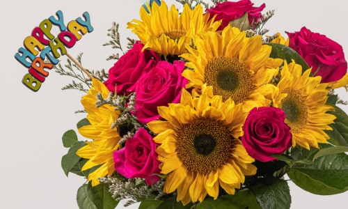 Happy birthday flower arrangement consisting of sunflowers and pink roses